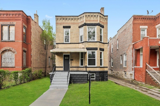 7421 S Eggleston Ave, Chicago, IL 60621 - view of front of home featuring brick siding and a front lawn