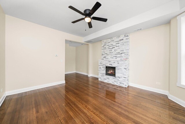 7421 S Eggleston Ave, Chicago, IL 60621 - unfurnished living room featuring wood finished floors, ceiling fan, baseboards, and a tile fireplace