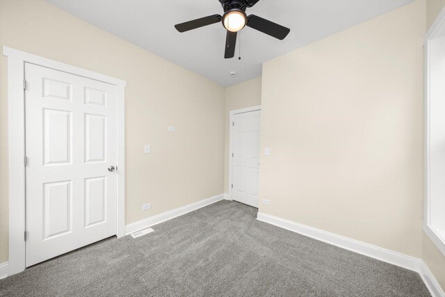 7421 S Eggleston Ave, Chicago, IL 60621 - unfurnished bedroom featuring carpet flooring, baseboards, and a ceiling fan
