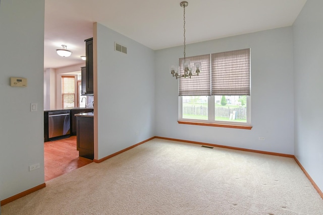 1804 Westbrook Ct, Plainfield, IL 60586 - empty room with light colored carpet, a chandelier, and baseboards