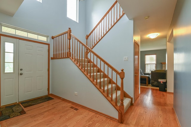 1804 Westbrook Ct, Plainfield, IL 60586 - foyer entrance featuring wood finished floors, stairs, and baseboards