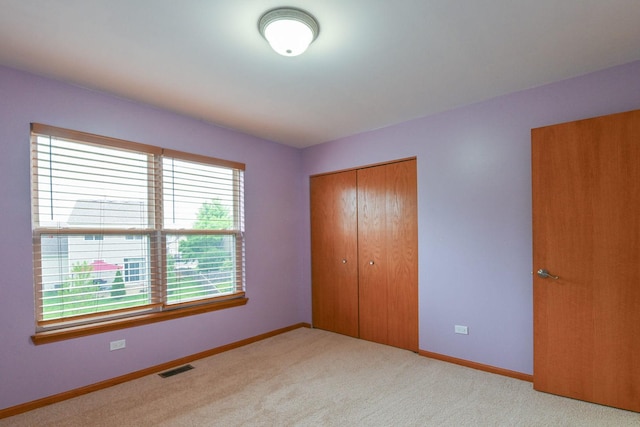 1804 Westbrook Ct, Plainfield, IL 60586 - unfurnished bedroom with a closet, baseboards, and carpet floors