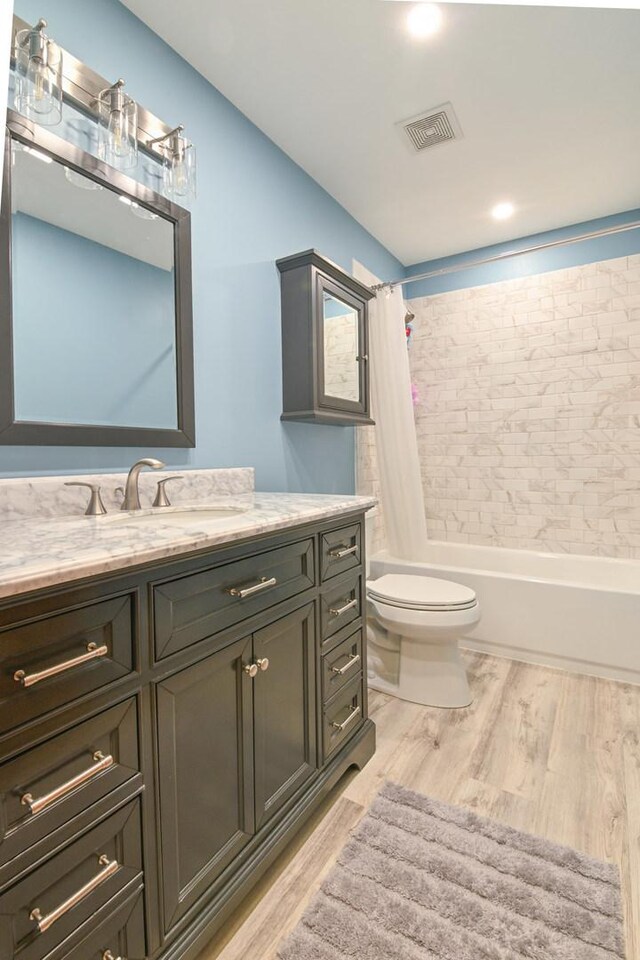 1804 Westbrook Ct, Plainfield, IL 60586 - bathroom featuring vanity, shower / bath combination with curtain, wood finished floors, and toilet