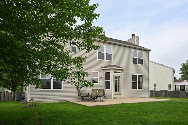 1804 Westbrook Ct, Plainfield, IL 60586 - rear view of property featuring a chimney, a patio area, and cooling unit