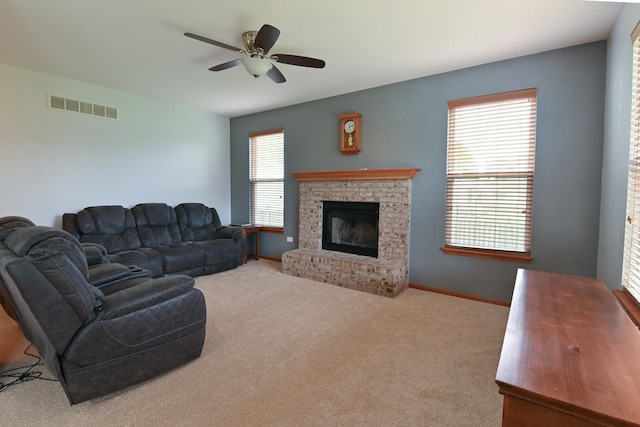 1804 Westbrook Ct, Plainfield, IL 60586 - carpeted living room featuring a fireplace, ceiling fan, and baseboards