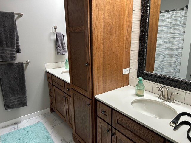 981 W Forsyth Rd, Forsyth, IL 62535 - full bathroom featuring vanity, marble finish floors, and baseboards