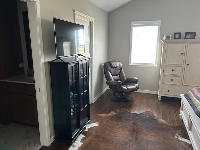 981 W Forsyth Rd, Forsyth, IL 62535 - living area featuring vaulted ceiling, baseboards, and wood finished floors
