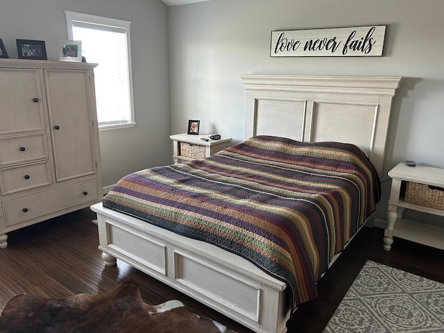 981 W Forsyth Rd, Forsyth, IL 62535 - bedroom with dark wood-style floors