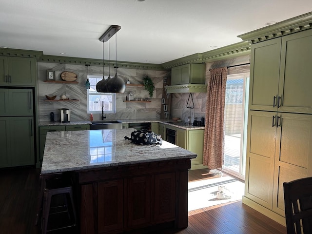 981 W Forsyth Rd, Forsyth, IL 62535 - kitchen with green cabinetry, a sink, and open shelves