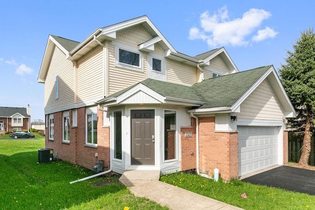 22429 Karlov Ave, Richton Park, IL 60471 - view of front of house featuring brick siding, a garage, a front lawn, driveway, and a shingled roof