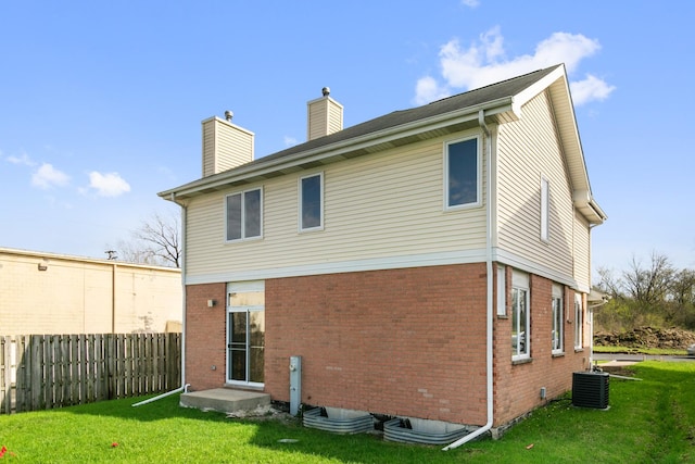 22429 Karlov Ave, Richton Park, IL 60471 - back of house featuring a chimney, central AC unit, and brick siding