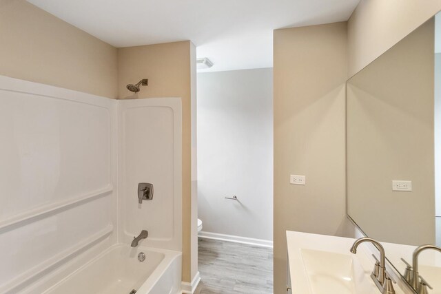 22429 Karlov Ave, Richton Park, IL 60471 - bathroom featuring  shower combination, toilet, wood finished floors, vanity, and baseboards