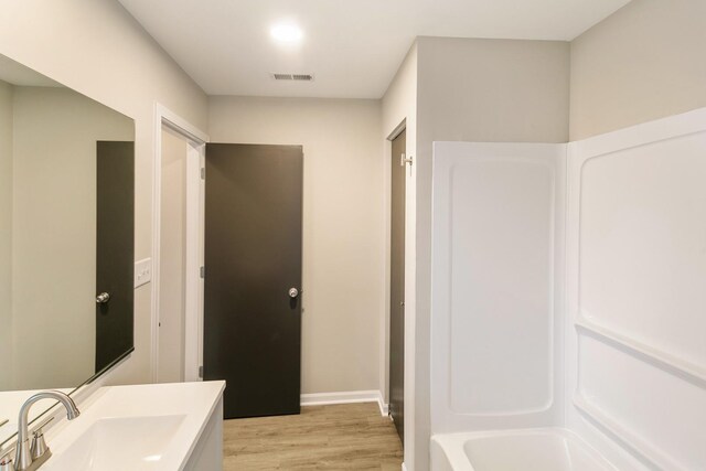22429 Karlov Ave, Richton Park, IL 60471 - bathroom with vanity, wood finished floors, and baseboards