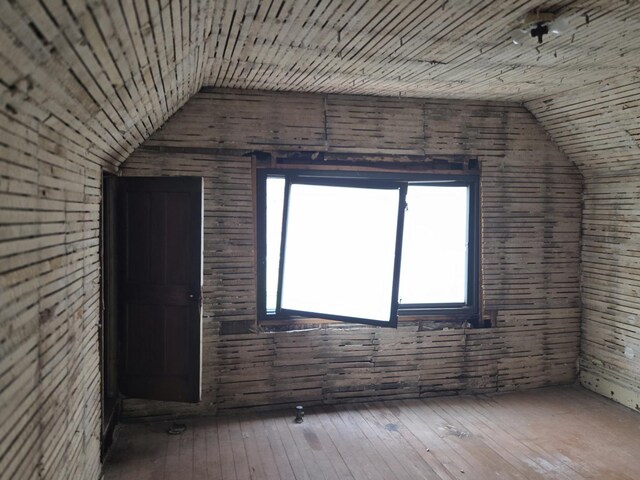 114 W 108th Pl, Chicago, IL 60628 - additional living space featuring lofted ceiling, hardwood / wood-style floors, and wooden walls