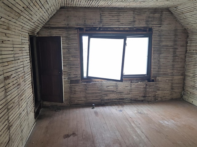 114 W 108th Pl, Chicago, IL 60628 - additional living space with vaulted ceiling, hardwood / wood-style flooring, and wooden walls