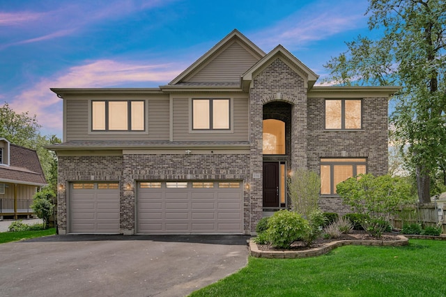 731 W Kenilworth Ave, Palatine, IL 60067 - traditional-style home with asphalt driveway, a garage, and brick siding