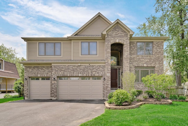 731 W Kenilworth Ave, Palatine, IL 60067 - view of front of property with driveway, brick siding, and a garage