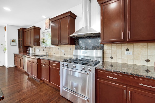 731 W Kenilworth Ave, Palatine, IL 60067 - kitchen with appliances with stainless steel finishes, wall chimney range hood, a sink, dark stone countertops, and recessed lighting