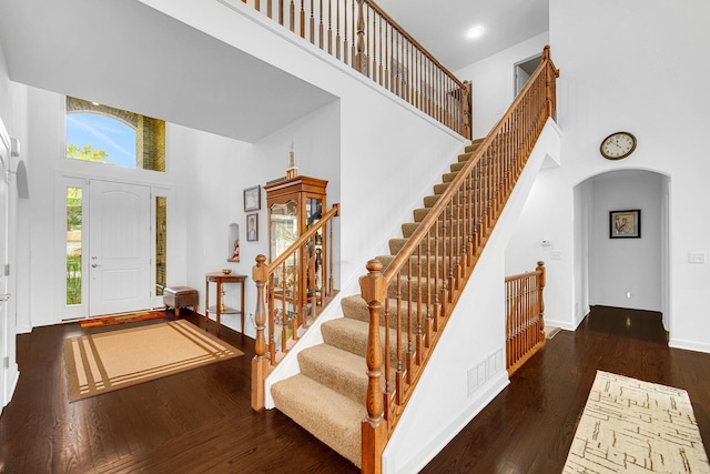 731 W Kenilworth Ave, Palatine, IL 60067 - entrance foyer with a towering ceiling, arched walkways, hardwood / wood-style flooring, stairway, and baseboards