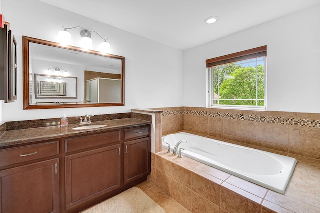 731 W Kenilworth Ave, Palatine, IL 60067 - full bath featuring vanity, a bath, a shower with door, tile patterned flooring, and recessed lighting