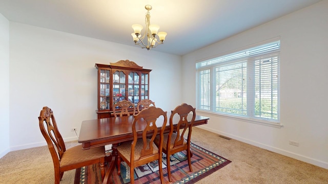 731 W Kenilworth Ave, Palatine, IL 60067 - carpeted dining area featuring a chandelier and baseboards