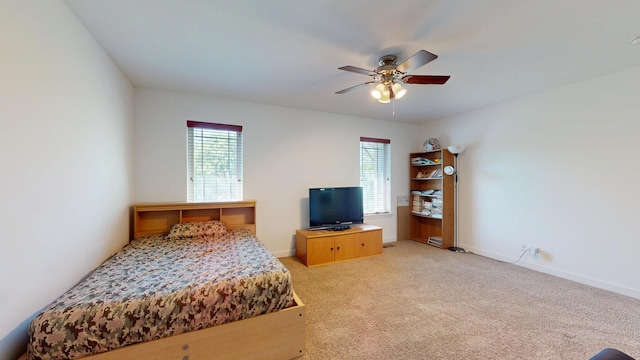 731 W Kenilworth Ave, Palatine, IL 60067 - bedroom with multiple windows, light colored carpet, ceiling fan, and baseboards