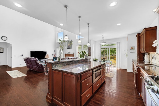 731 W Kenilworth Ave, Palatine, IL 60067 - kitchen with a sink, dark wood finished floors, dark stone counters, open floor plan, and recessed lighting