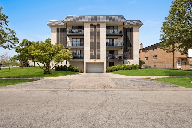 6950 W Forest Preserve Dr Unit 215, Norridge, IL 60706 - view of property with an attached garage and driveway