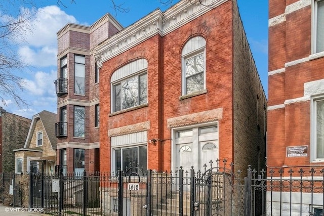 1418 N Campbell Ave, Chicago, IL 60622 - view of building exterior with a fenced front yard
