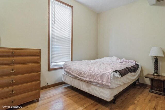 1418 N Campbell Ave, Chicago, IL 60622 - bedroom with light wood-style floors and baseboards