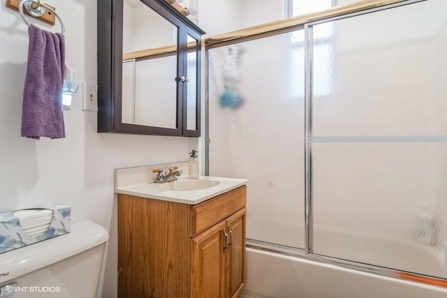 1418 N Campbell Ave, Chicago, IL 60622 - bathroom with toilet, vanity, bath / shower combo with glass door, and healthy amount of natural light