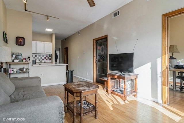 1418 N Campbell Ave, Chicago, IL 60622 - living area featuring light wood finished floors, ceiling fan, and rail lighting