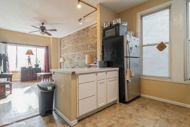 1418 N Campbell Ave, Chicago, IL 60622 - kitchen featuring freestanding refrigerator, a ceiling fan, white cabinets, baseboards, and light countertops
