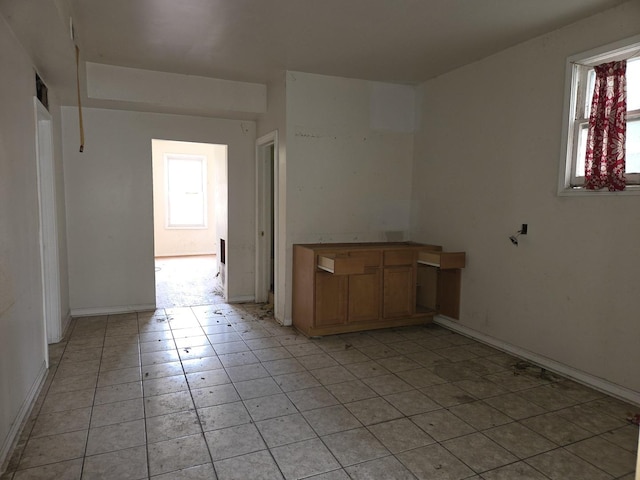 8408 S Baker Ave, Chicago, IL 60617 - unfurnished room with baseboards and light tile patterned floors