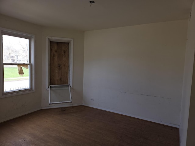 8408 S Baker Ave, Chicago, IL 60617 - empty room with wood finished floors and baseboards