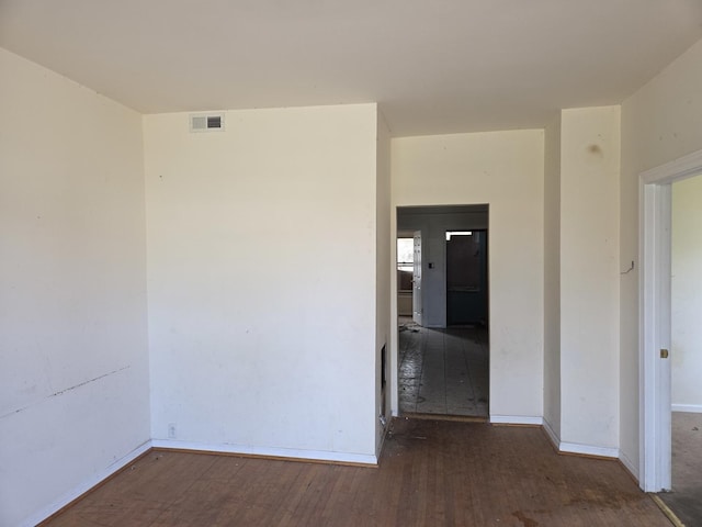 8408 S Baker Ave, Chicago, IL 60617 - unfurnished room with wood finished floors and baseboards