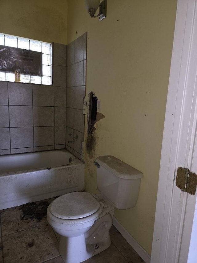 8408 S Baker Ave, Chicago, IL 60617 - bathroom with toilet, a bathtub, and tile patterned flooring