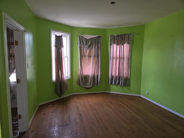 8408 S Baker Ave, Chicago, IL 60617 - spare room featuring wood finished floors and baseboards