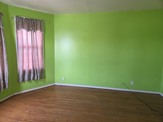 8408 S Baker Ave, Chicago, IL 60617 - empty room with wood finished floors and baseboards