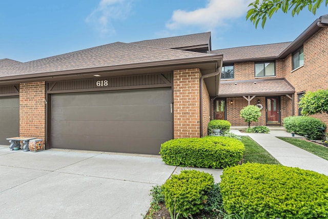618 Cress Creek Ln, Crystal Lake, IL 60014 - view of front facade featuring brick siding, driveway, a shingled roof, and an attached garage