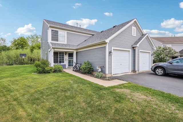 5 Crimson Ct, Lake In The Hills, IL 60156 - traditional-style house featuring an attached garage, asphalt driveway, a front lawn, and a shingled roof