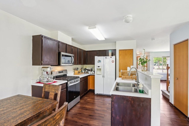5 Crimson Ct, Lake In The Hills, IL 60156 - kitchen with stainless steel appliances, a sink, dark wood-style floors, and light countertops