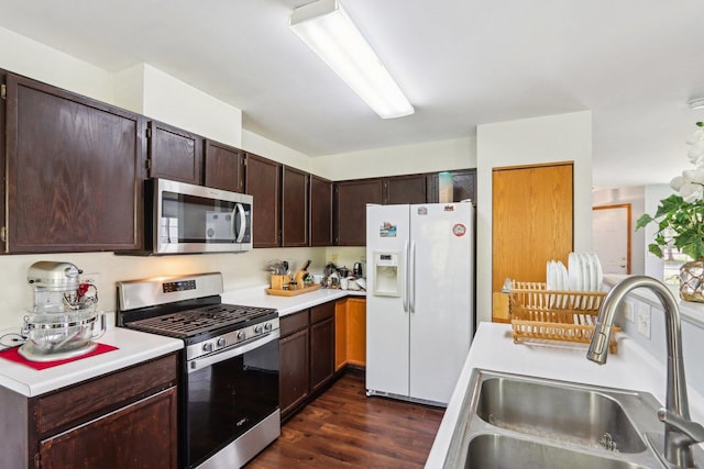 5 Crimson Ct, Lake In The Hills, IL 60156 - kitchen featuring stainless steel appliances, a sink, light countertops, and dark wood-style flooring