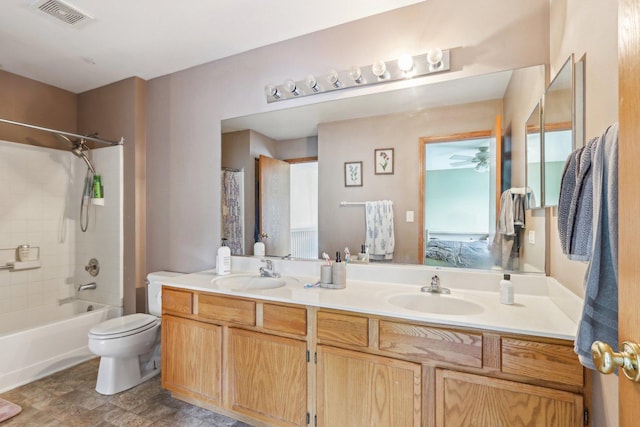 5 Crimson Ct, Lake In The Hills, IL 60156 - full bath with double vanity, shower / bathtub combination, toilet, ceiling fan, and ensuite bath