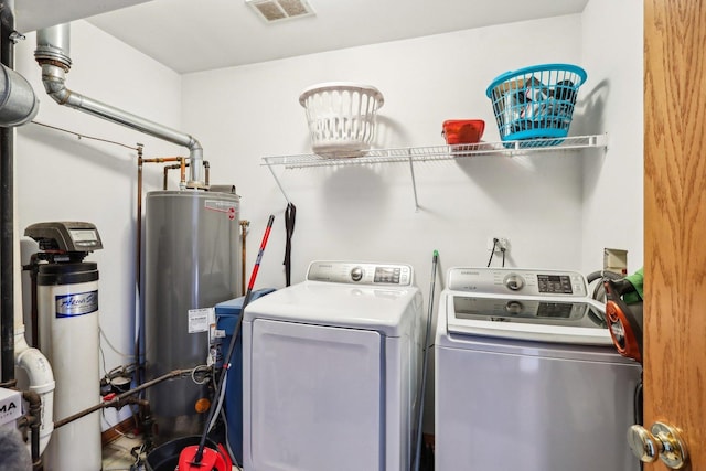 5 Crimson Ct, Lake In The Hills, IL 60156 - laundry room with water heater and washing machine and dryer