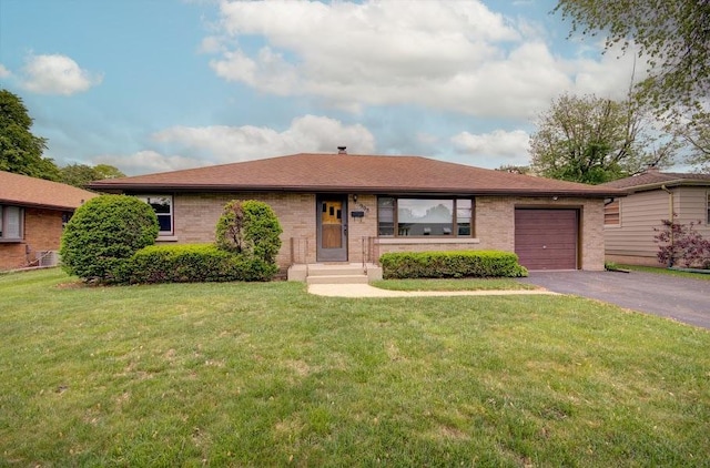 908 Catherine St, Joliet, IL 60435 - single story home featuring asphalt driveway, a garage, a front lawn, and brick siding