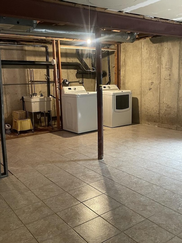 unfinished below grade area featuring washer and dryer