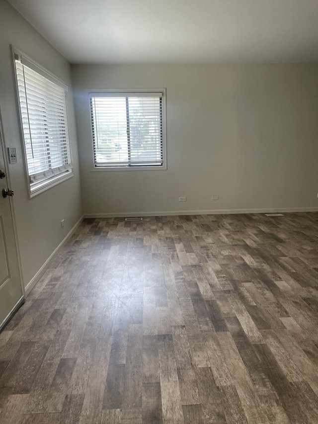 empty room with dark wood-style floors