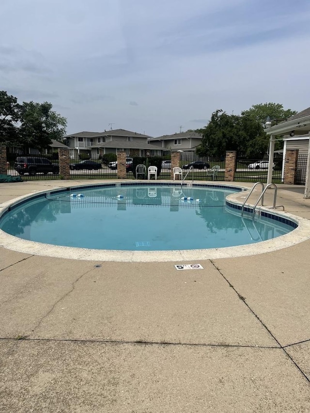 community pool with a patio