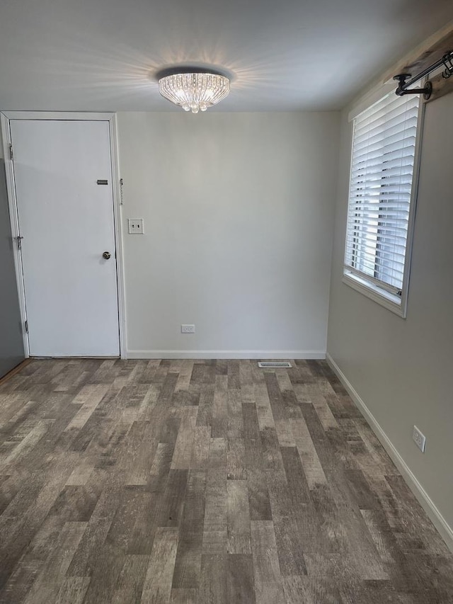 empty room featuring wood finished floors